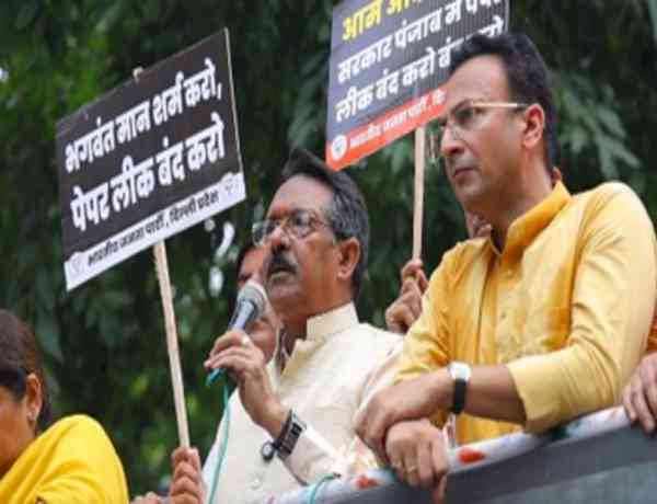 Delhi BJP chief leads protest against paper leaks in Punjab, seeks AAP Minister's dismissal