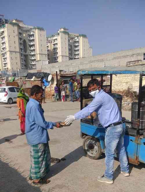 DLF feeding over 10,000 stranded migrant labourers in Noida