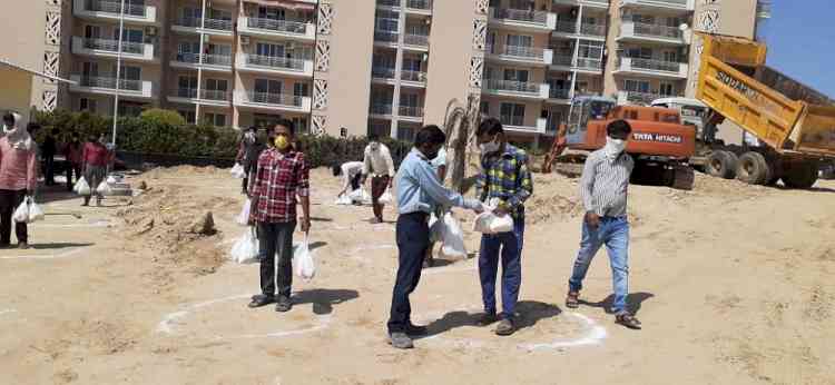 Elan Group distributes one month of ration to over 2000 construction workers