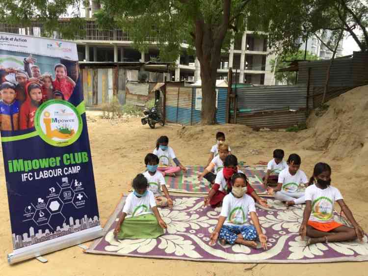 Children of construction workers commemorate ‘International Yoga Day’