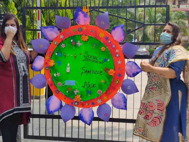 Ten feet long rakhi embedded with corona virus preventive messages for community