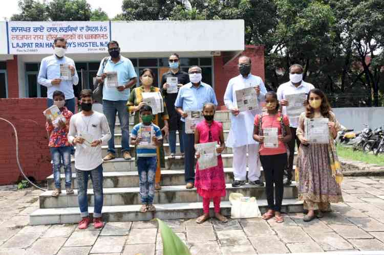 Tree plantation drive and handmade bags made by children of construction workers launched at PU