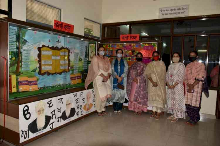 KMV inaugurates new display board in library