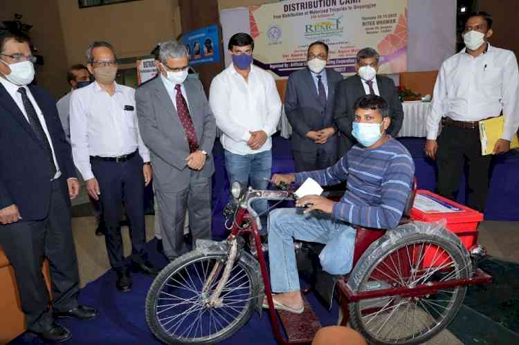 REMCL distributes motorised tricycles among divyangs