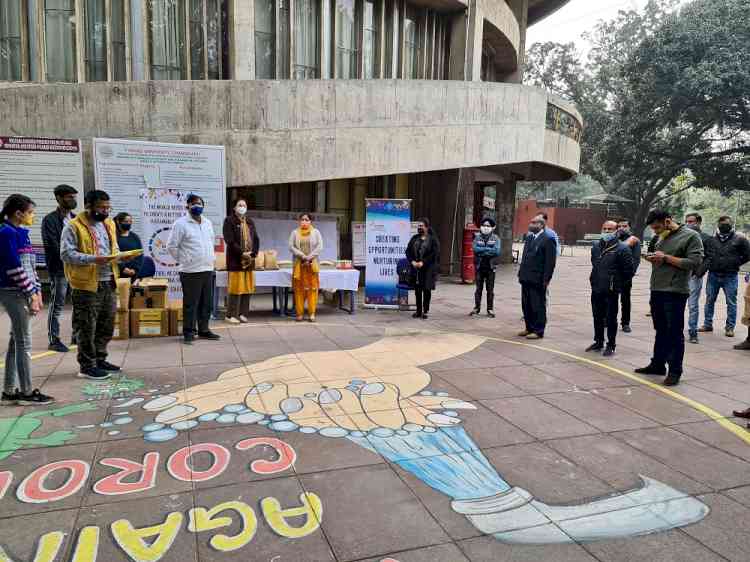 Enactus team of PU distributed face shields among frontline workers of university