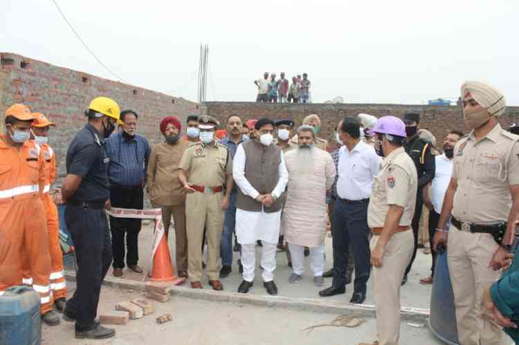 Bharat Bhushan Ashu and Sunder Sham Arora inspect factory roof collapse site in Daba Road Industry Area