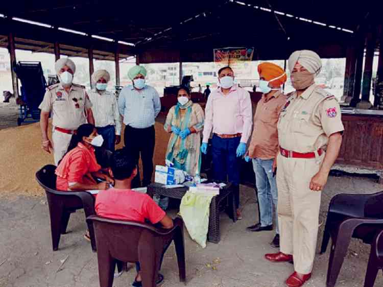 Health department holds awareness drive in grain markets against Covid -19