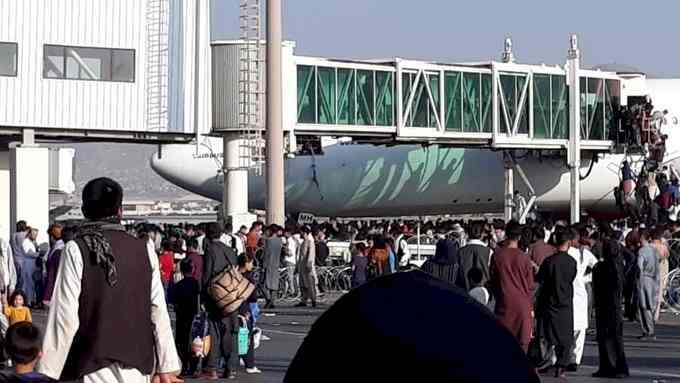 Chaos as people running around in Kabul airport to board flights