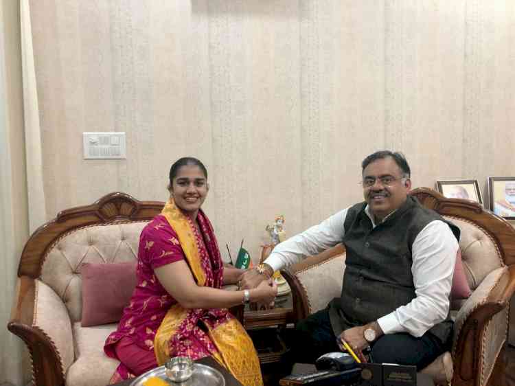 Babita Phogat tied a rakhi to Chugh at his residence today