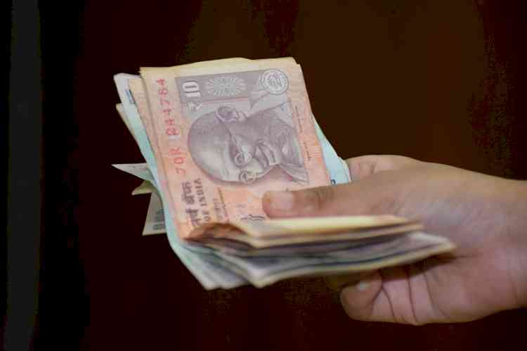 Rupee slips to 15-month low on rising crude oil prices