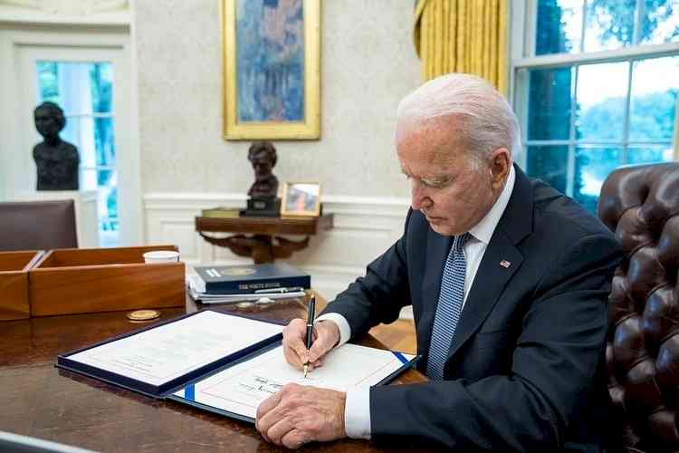 Biden signs short-term bill to raise debt limit