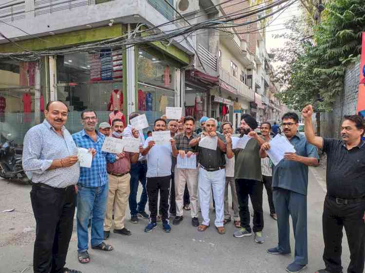 Traders torn copies of professional tax as mark of protest
