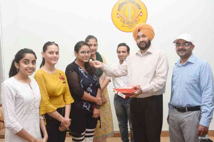 Simranjit Kaur and Yashasvi Sharma of Lyallpur Khalsa College stand first