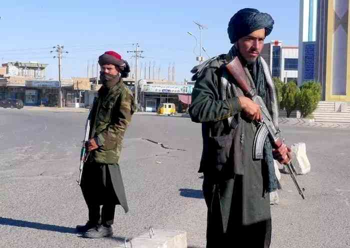 Taliban gunmen checking mobile phones of Kabul residents