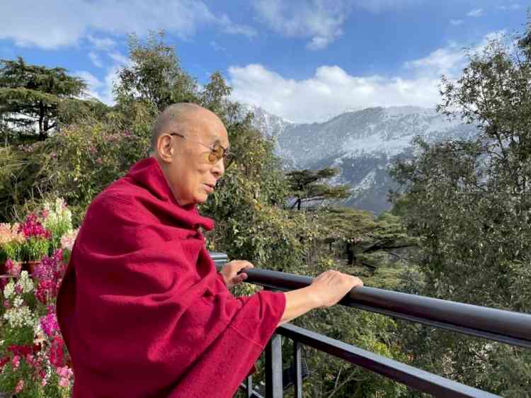 Dalai Lama gazes long look homeward
