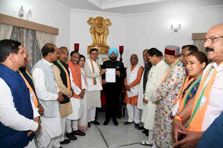 Dhami stakes claim to form govt in Uttarakhand