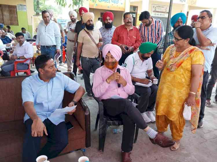 Officials reach out to villagers to resolve their problems