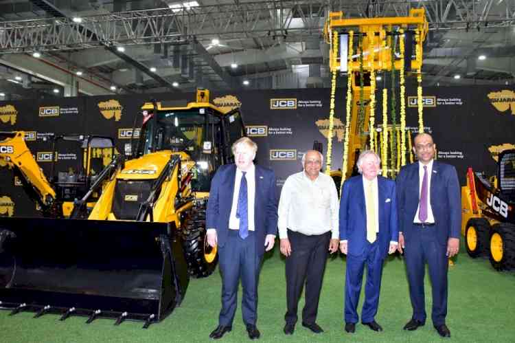 UK PM hops onto bulldozer at JCB plant in Gujarat