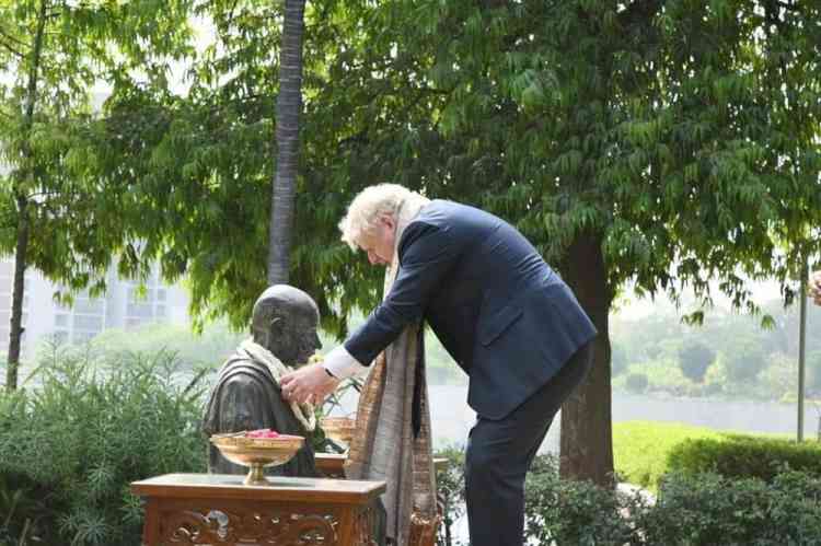 Boris Johnson visits Sabarmati Ashram, tries his hand at spinning on 'Charkha'