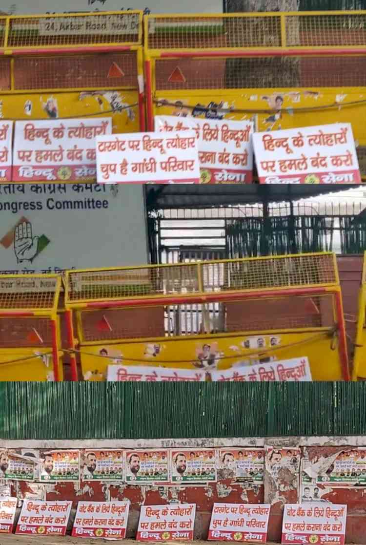 Hindu Sena activists put up posters outside Cong HQ