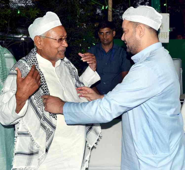 Nitish sees off Tejashwi to his car at JD-U's Iftar party