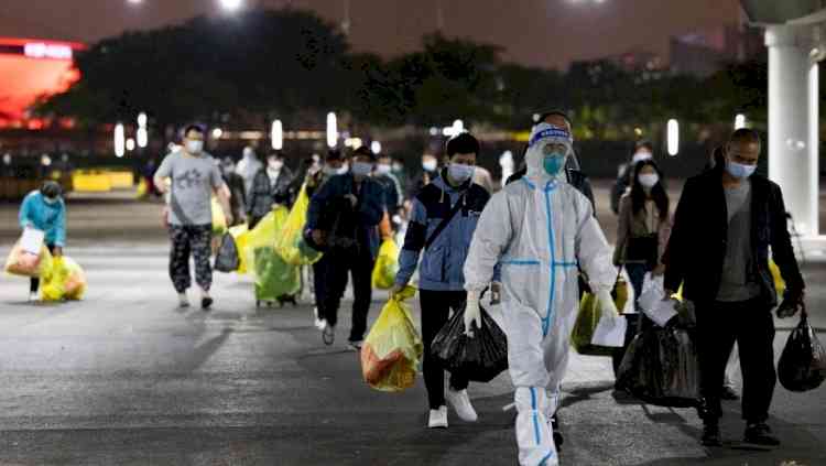 Defiant Shanghai residents break out of their own homes