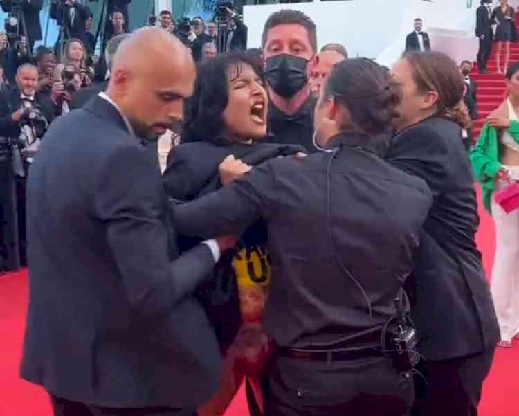 Woman protesting Ukraine sexual violence removed from Cannes red carpet