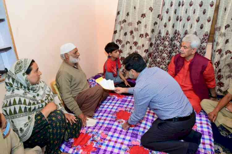 J&K LG meets family members of slain Kashmiri artiste Amreen Bhat