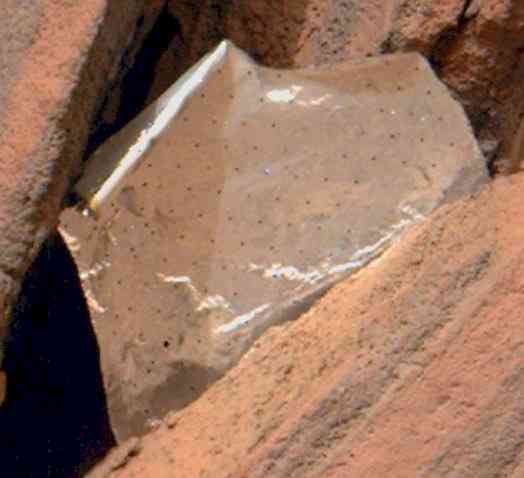 NASA Mars rover spots shiny foil piece between rocks