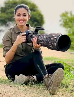 Actress-wildlife photographer Sadaa poses with panther named Shyama