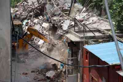 UP: Bulldozer runs on 'illegal' shops outside SP office