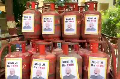 TRS hits back at FM with PM's pictures on LPG cylinders