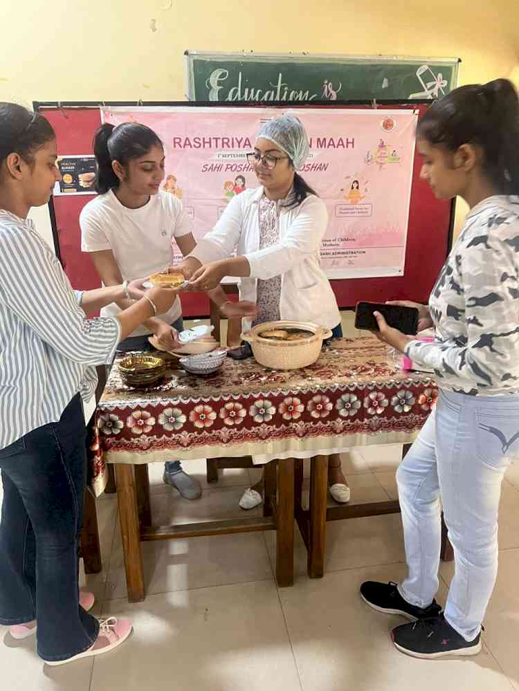Students prepare and sell healthy burgers at Home Science College