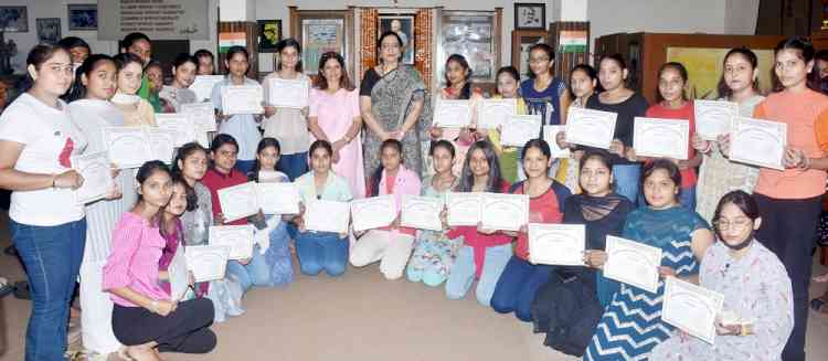 KMV award certificates to girls receiving free education under Gandhian Studies Centre on occasion of Gandhi Jayanti