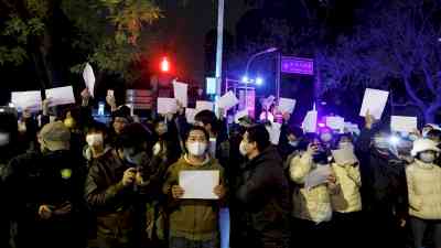 China's censors try to wipe images of blank sheets of white paper used by protesters