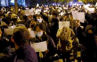 Chinese crowds hold up blank sheets to hit out at censorship