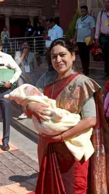 Cuddling baby in arms, NCP MLA attends Maha Legislature