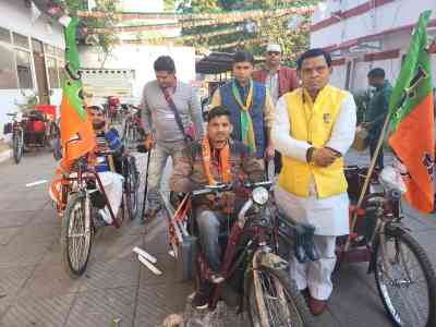 Delhi BJP Working President distributes battery tricycles to 'Divyangs'