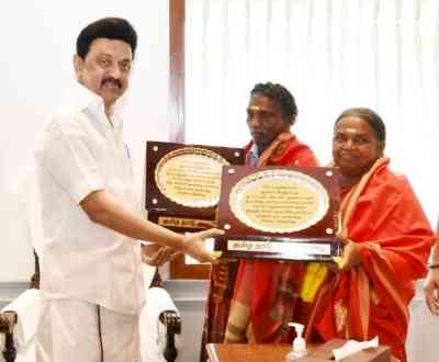 Stalin felicitates elephant whisperers Bomman and Bellie