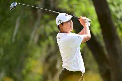 Korea's Lee sparkles 67 as Tom Kim, Si Woo ensure cut; Woods hangs by slender thread, McIlroy out