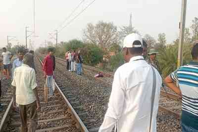 UP: Man forces son to sit on railway tracks in viral video