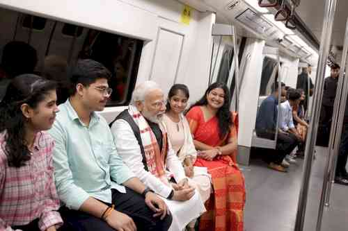 PM Modi takes metro on his way to DU, interacts with youngsters
