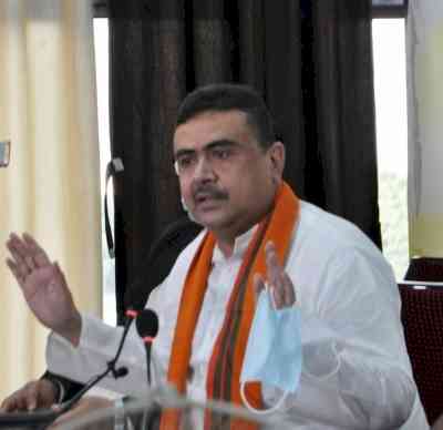 Suvendu Adhikari posts video of cop holding umbrella for Trinamool leader