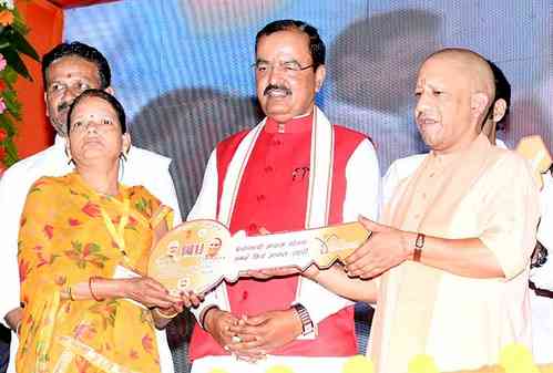 Yogi hands over 76 flats built on land confiscated from Atiq Ahmed