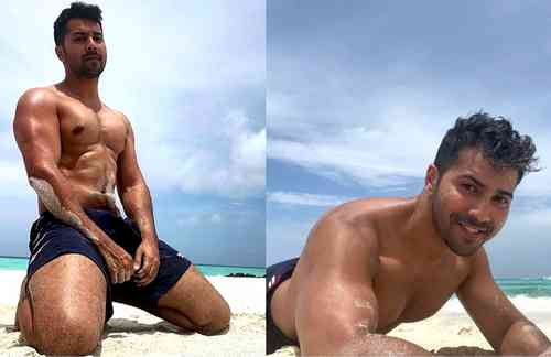 Varun Dhawan flaunts toned beach body; fans call him ‘sandman’