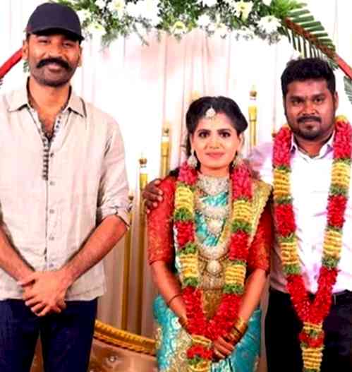 Dhanush sports casuals as he attends assistant's wedding