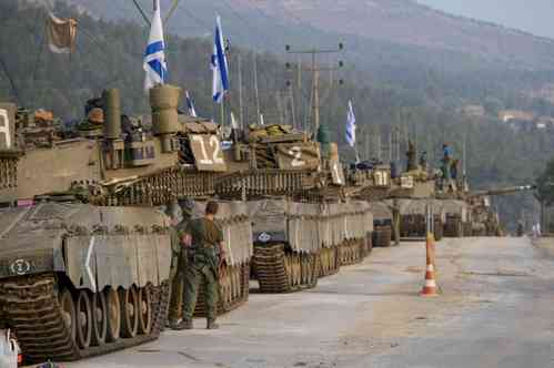 Israel moves hundreds of tanks close to Gaza fence as ground invasion looms
