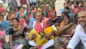 Telangana minister lifts elderly woman in arms during campaign