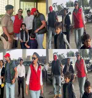 Saif, Kareena jet off for Christmas vacation; Taimur, Jehangir hold hands at airport