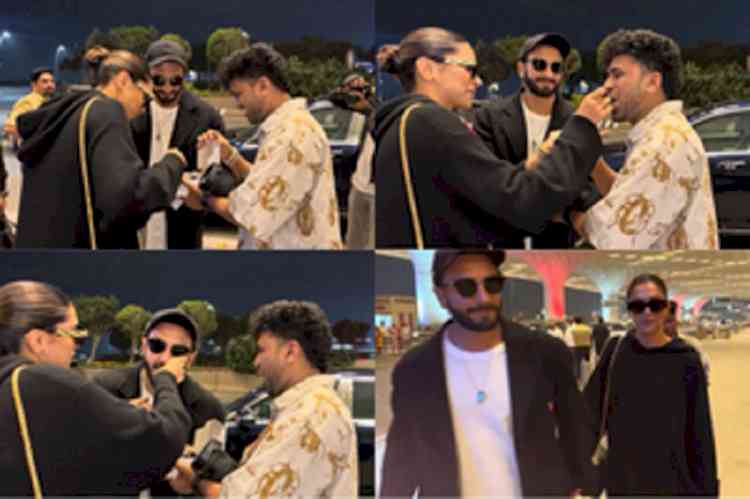 Deepika cuts b'day cake at Mumbai Airport before flying out with Ranveer